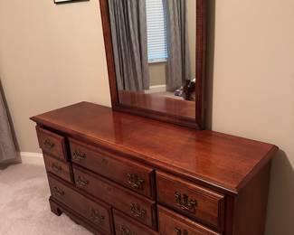Cherry dresser with mirror.