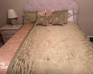 Full size Ivory upholstered bed with mattress.