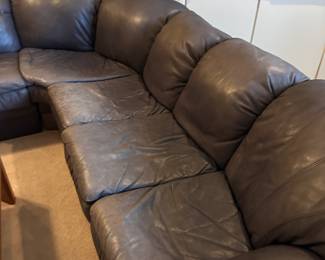 Gray leather section sofa.