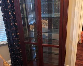 Lighted display cabinet with painted flower. We have 2 of these. Cabinet is in excellent condition.