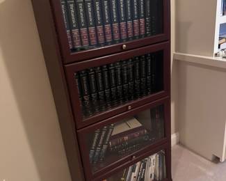 Dark wood law book case with glass shelves. We have 3 of these.