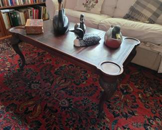 Leather top, carved leg coffee table by The Company of Master Craftsmen