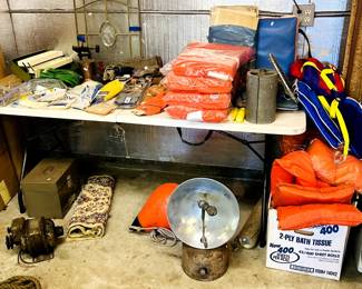 Boating supplies, life vests, vintage charts, old heater, boat bumper, styrofoam coolers