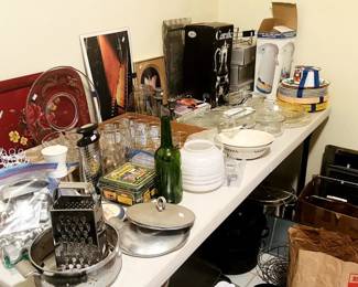 Kitchen supplies, baking sheets, cooling racks, plates, bowls, dishes, glass jars