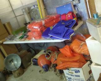 Boating supplies, life vests, styrofoam coolers, vintage charts, heater, boat bumpers, gloves