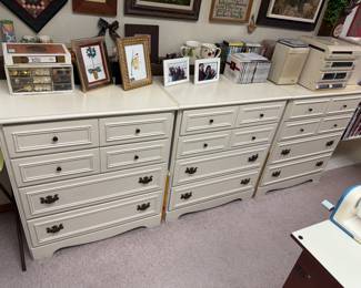 three identical storage cabinets
