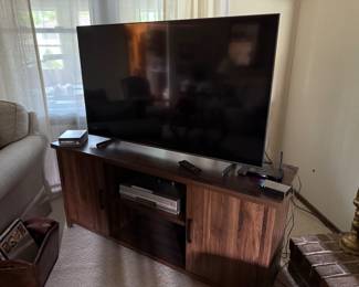Large flatscreen television and television stand