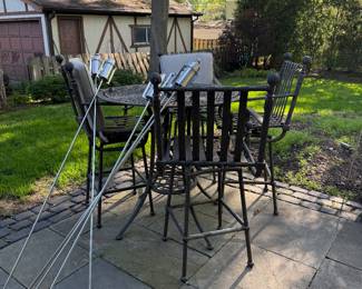 Pub style table with 4 swivel wrought iron chairs