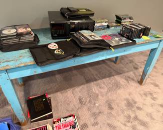 misc. CDs & DVDs; rustic wood teal table