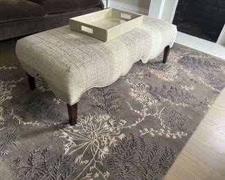 Upholstered bench; area rug