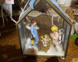 Sweet nativity in glass box.