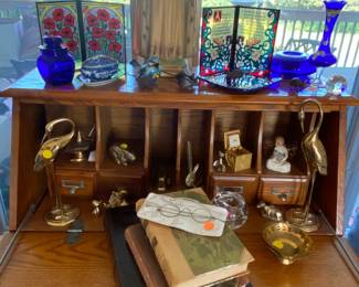 Items displayed on the desk in the living room.