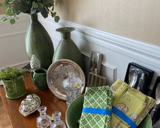 Large green vases and complimentary decorations.