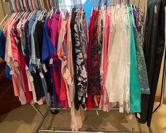 Racks of ladies blouses and tees.