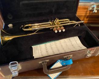 Trumpet in case - looks like it was never used or played.