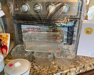 Vintage refrigerator dishes and brand new toaster oven.