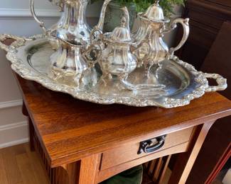 Large Towle silverplate tray with coffee/tea service on Mission oak side table.