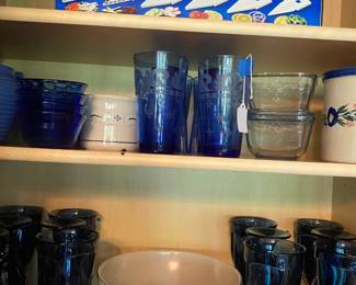 Blue stemmed water glasses and utility items.