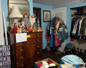 Dresser and dolls, mirror and artwork