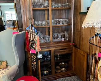 Lamp, cabinet, chairs, necklaces, stem ware, silver-plated bowls.