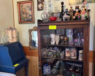 Quarter-sawn white oak cabinet with many bar accessories