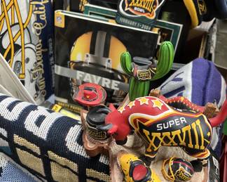 NFL lot featuring Super Bowl memorabilia, Brett Favre book magazine, artwork, throw, hats, patches