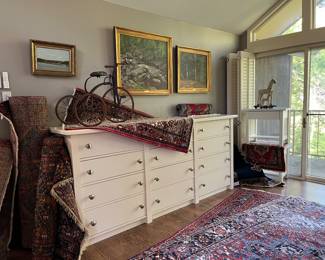 Oil paintings and Persian rugs.