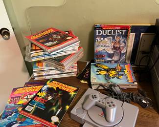 Sony Play Station with Nintendo strategy guides.