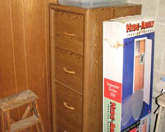 Hide-Away Iron Board, small wood ladder and a wood file cabinet