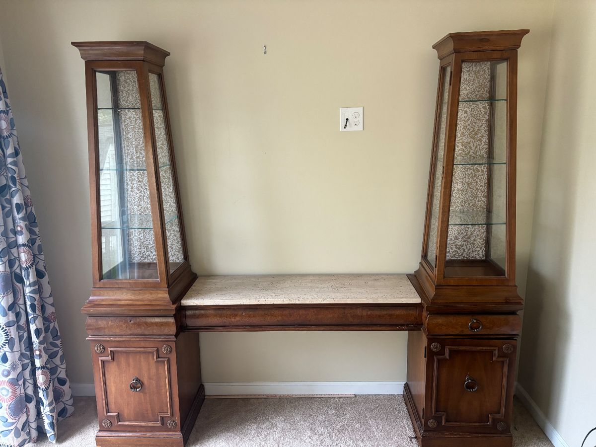 Antique breakfront with glass casing for knickknack/furnishings display.