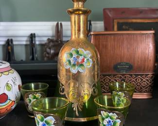 Small glasses and a matching fillable bottle.