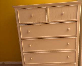 Dresser with deep drawers to hold a large assortment of clothing. Matches the bedside table and shelving unit.