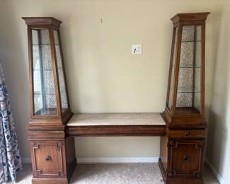 Antique breakfront with glass casing for knickknack/furnishings display.