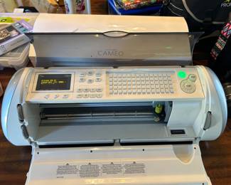 The Provo Craft Cricut Expression Machine is a machine that can cut letters, shapes, and phrases in large sizes using a 12"x24"