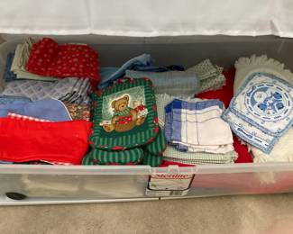 Lots of table linens-- tablecloths, napkins, table runners, and placemats