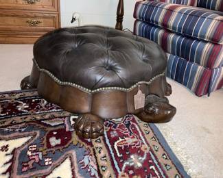 Leather top tortoise ottoman