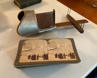 Antique handheld stereoscope with images