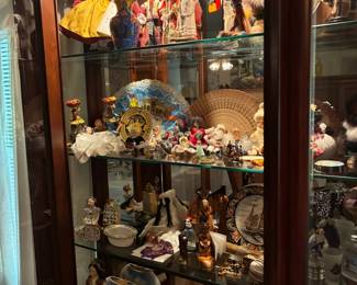Cabinet full of a lifetime's memories from world travels. Amazing variety of cultures represented!