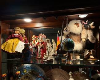 Cabinet full of a lifetime's memories from world travels. Amazing variety of cultures represented!