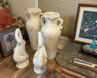 Oversized urns and swan statuary