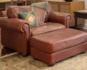 Leather chair and a half with ottoman.