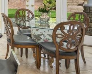 Chinese ceramic fishbowl on pedistal with glass table top and six chairs.