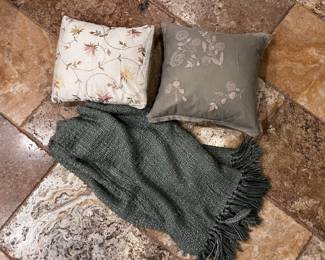 Throw pillows and blanket.