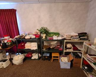 linens, shelving, charger plates, candles, towels