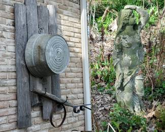 primitive wall decorations & concrete statue