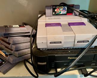 Super Nintendo with controllers and games