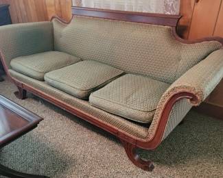 Carved antique Duncan Phyfe sofa and mahogany glass top display table
