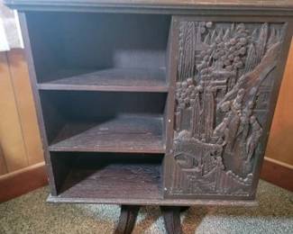 Revolving Asian carved bookcase
