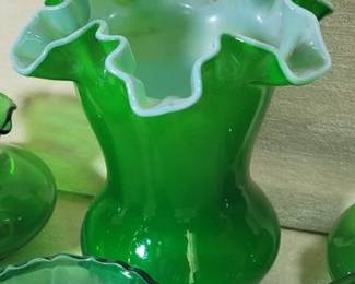 Emerald green glass pieces, including a ruffle edge vase