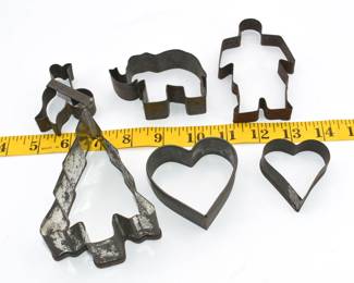 lot of vintage cookie cutters with display case